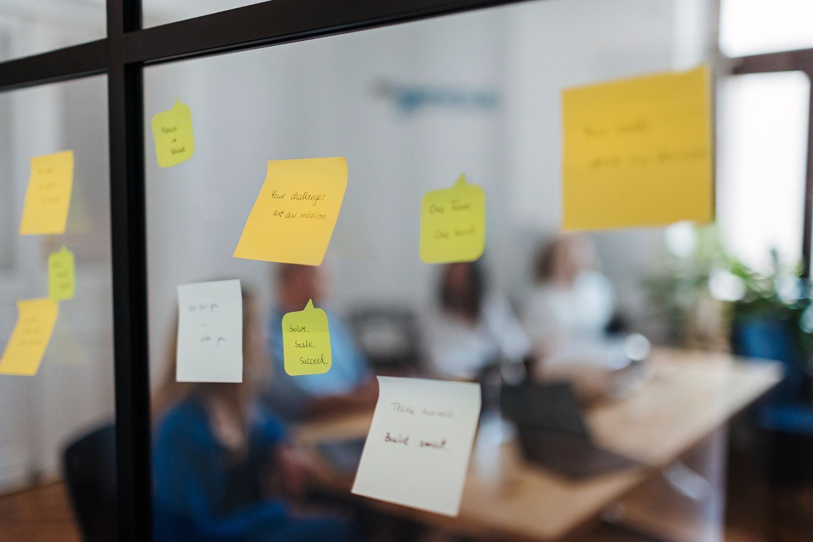 Project planning notes on a glass wall in the Engenious office